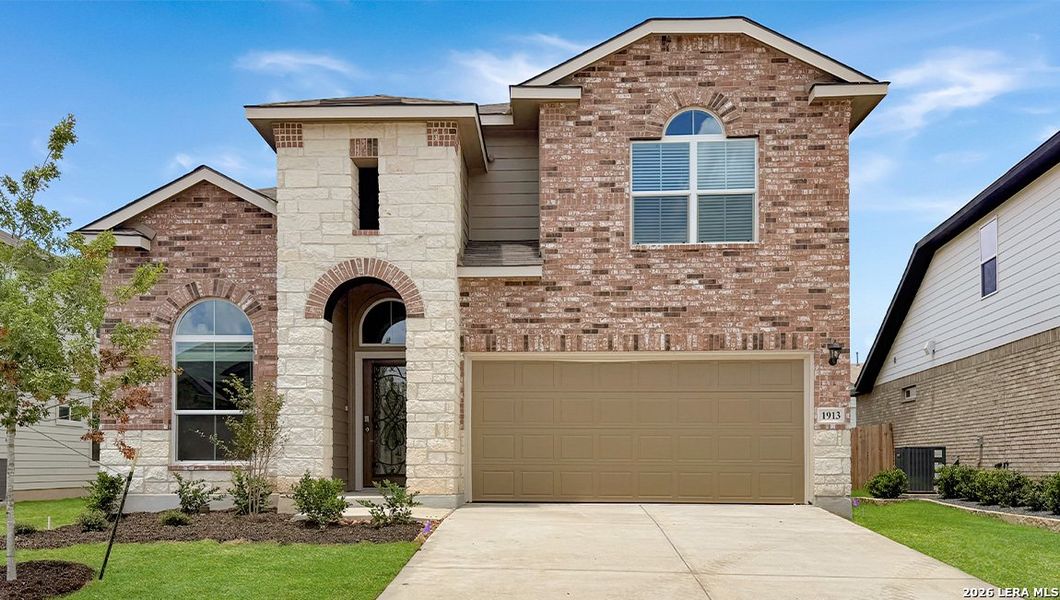 Front exterior of a new home in Veranda, San Antonio, TX, highlighting curb appeal (Image 1). Front exterior of a new home in Veranda, San Antonio, TX, highlighting curb appeal (Image 1).