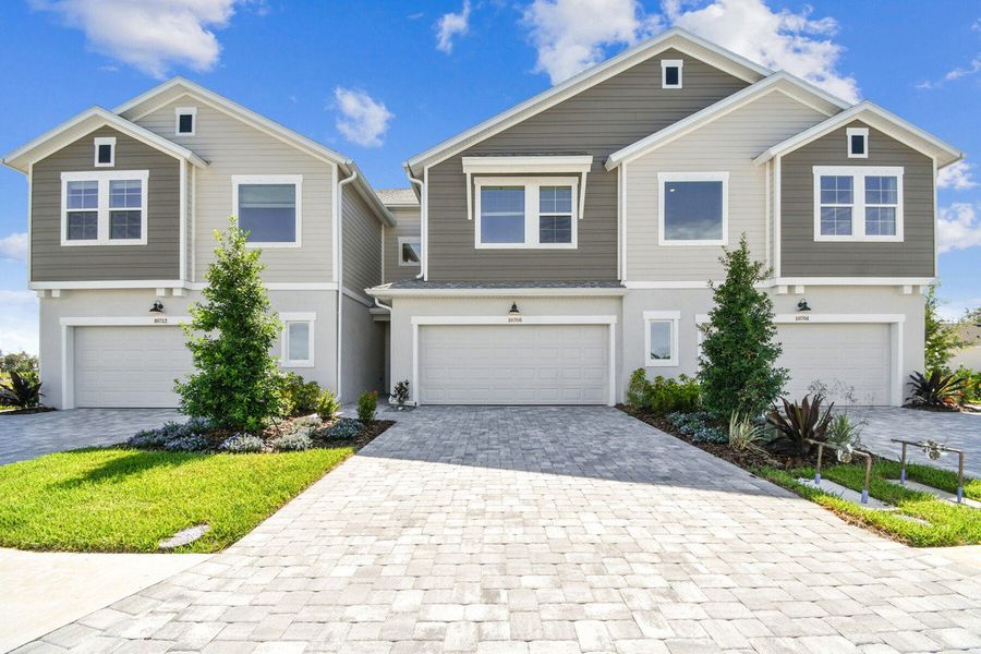 Representative exterior photo of a completed home built from the The Truman by David Weekley Homes in North River Ranch – Townhomes, Parrish, FL (Image 1).
