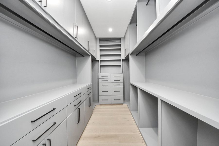 His closet with custom built ins