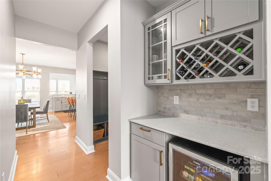 Stylish butler's pantry with beverage cooler transitions the kitchen and breakfast area to the formal dining room Stylish butler's pantry with beverage cooler transitions the kitchen and breakfast area to the formal dining room