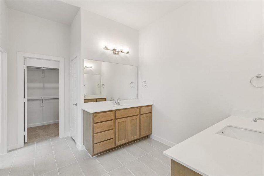 Primary Bathroom in the Da Vinci II home plan by Trophy Signature Homes – REPRESENTATIVE PHOTO