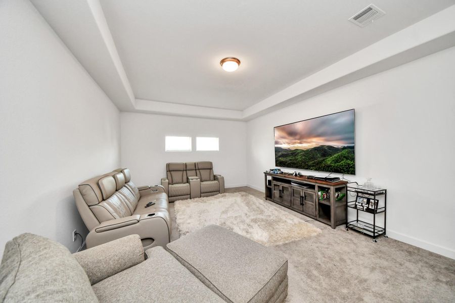 Flexible space ideal for a media room or game room.