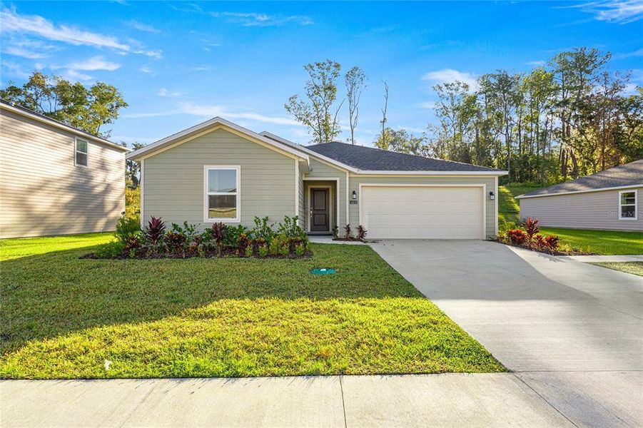 Front exterior of a new home in Tara Forest East, Alachua, FL, highlighting curb appeal (Image 2).