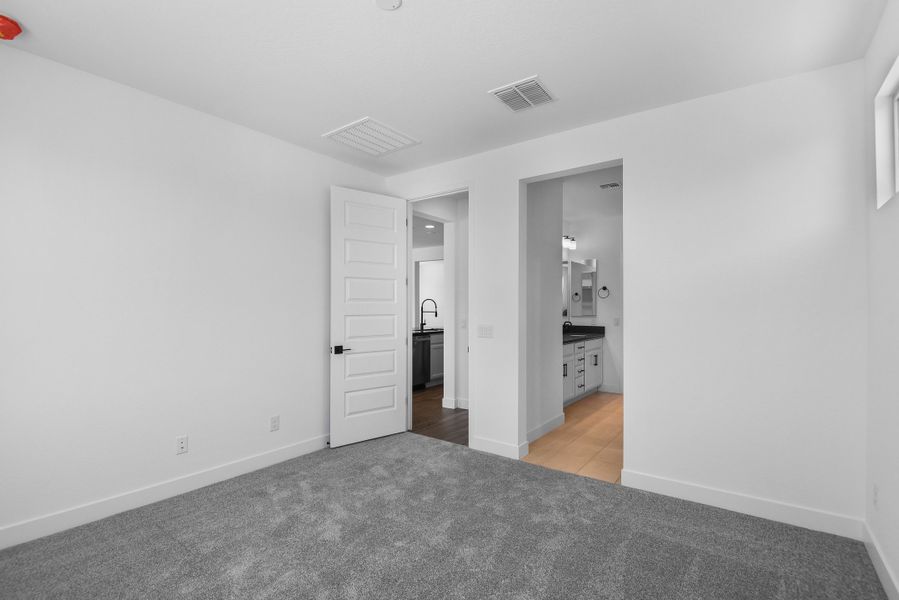 Spacious, unfurnished interior of a new home in CantaMia at Estrella 55+, Goodyear (Image 28).