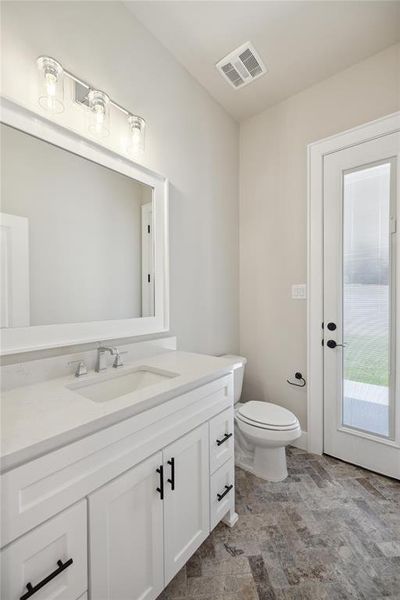 Bathroom with toilet and vanity