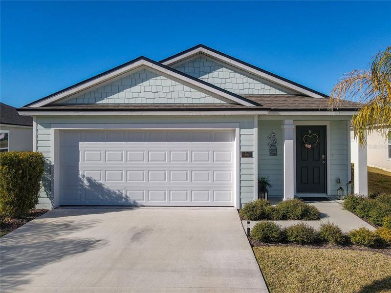 Front exterior of a new home in , Bunnell, FL, highlighting curb appeal (Image 2). Front exterior of a new home in , Bunnell, FL, highlighting curb appeal (Image 2).