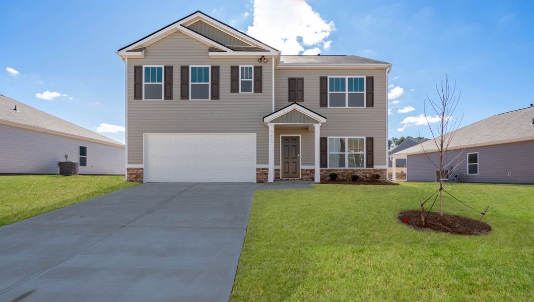 Front exterior of a new home in Lightwood Cottages, Moore, SC, highlighting curb appeal (Image 1).