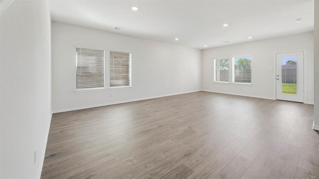 Spare room with light wood-type flooring and recessed lighting