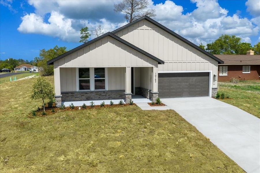 Front exterior of a new home in , Spring Hill, FL, highlighting curb appeal (Image 28).