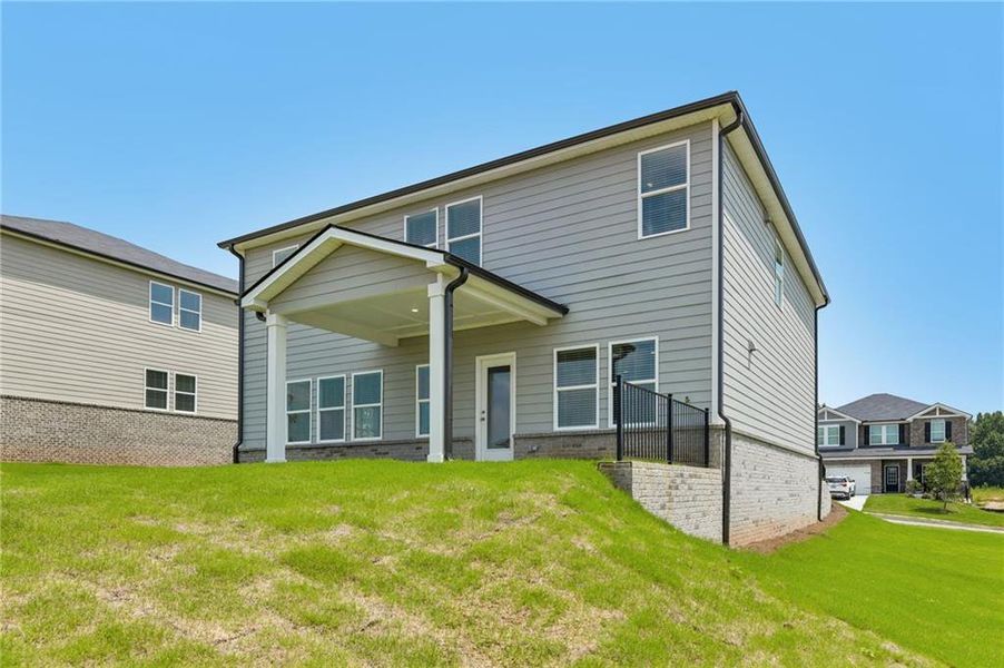 Exterior details and patio area of a home in Preserve at Mountain Creek, Pendergrass (Image 25).