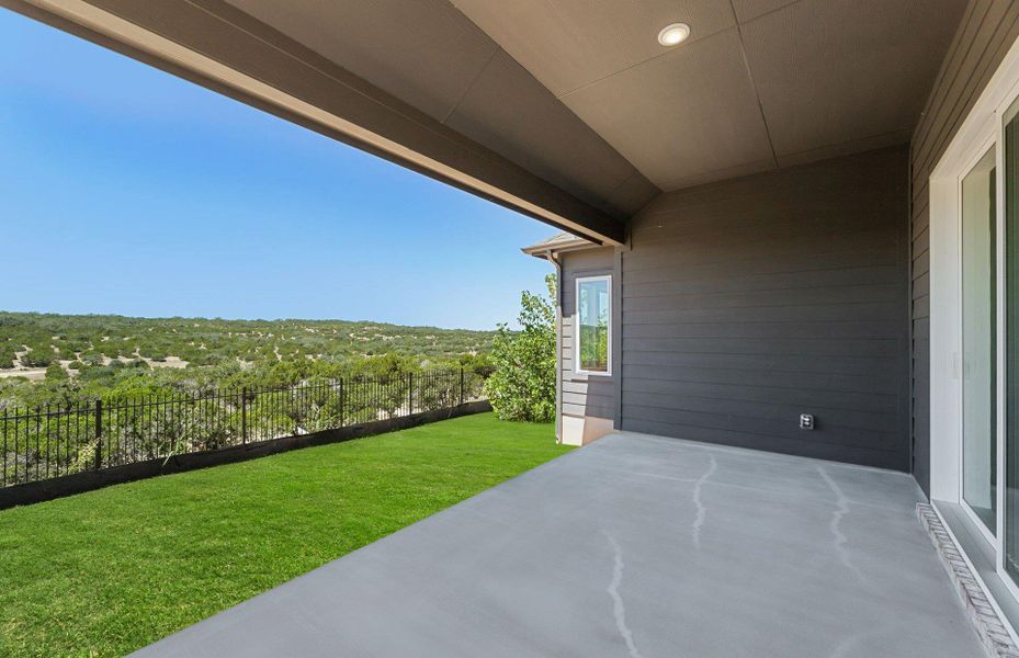 Exterior details and patio area of a home in West Cypress Hills, Spicewood (Image 20).