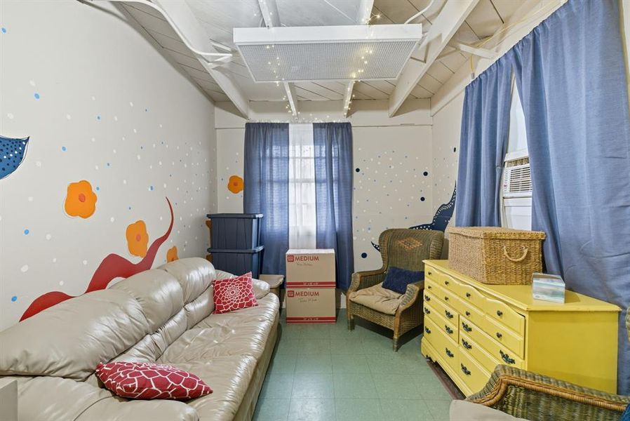 Living area featuring tile patterned floors Living area featuring tile patterned floors