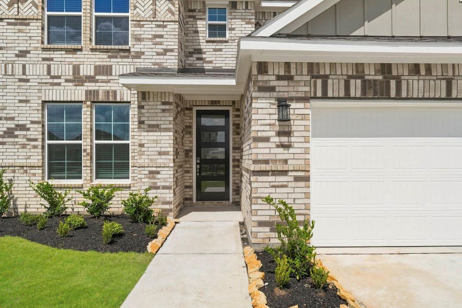 Exterior details and patio area of a home in Sunterra Lakes, Brookshire (Image 3). Exterior details and patio area of a home in Sunterra Lakes, Brookshire (Image 3).