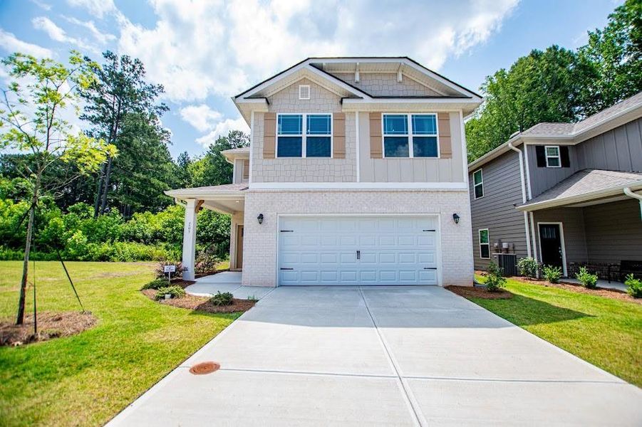 Front exterior of a new home in Windmill Park, Carrollton, GA, highlighting curb appeal (Image 1). Front exterior of a new home in Windmill Park, Carrollton, GA, highlighting curb appeal (Image 1).