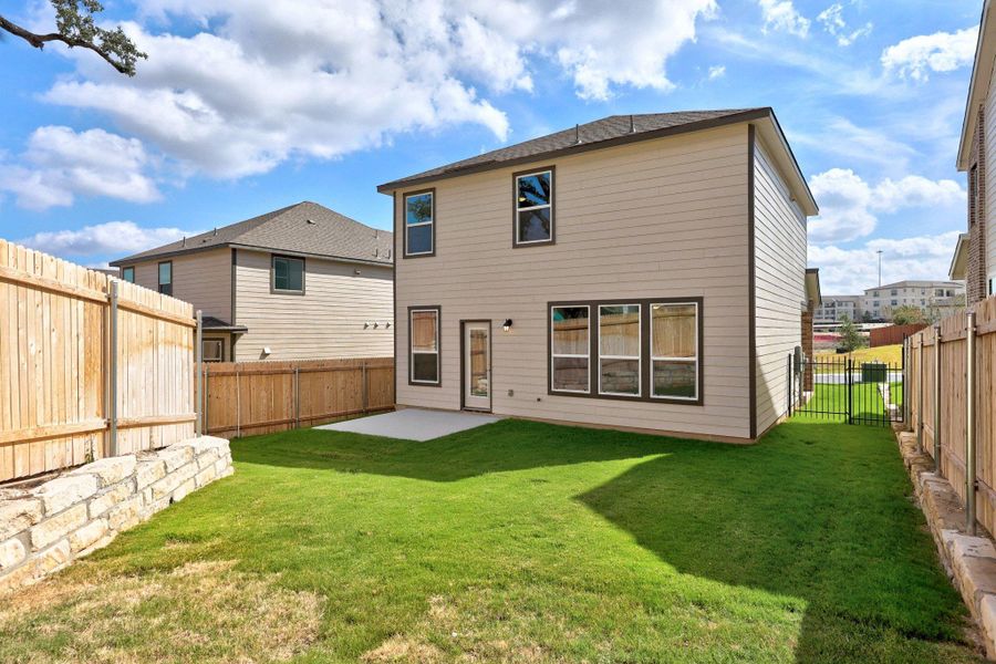 Exterior details and patio area of a home in Creekside at Estancia, Austin (Image 17).