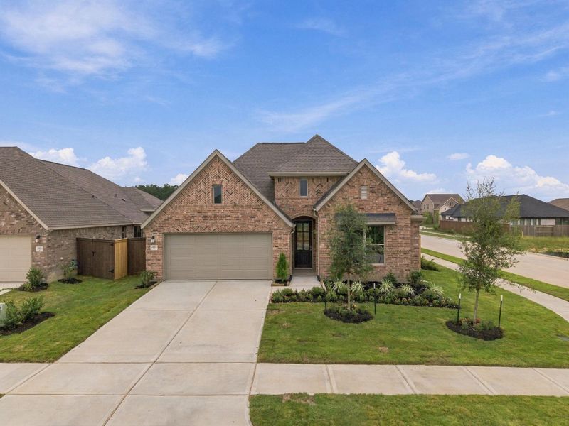 Front exterior of a new home in The Trails, New Caney, TX, highlighting curb appeal (Image 16). Front exterior of a new home in The Trails, New Caney, TX, highlighting curb appeal (Image 16).
