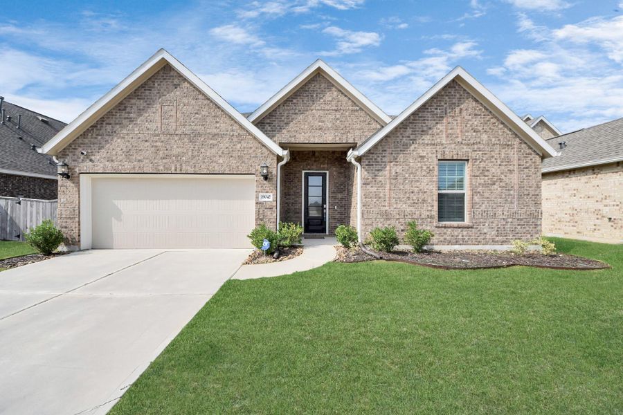 Front exterior of a new home in Tavola: Fairway Collection, New Caney, TX, highlighting curb appeal (Image 2).