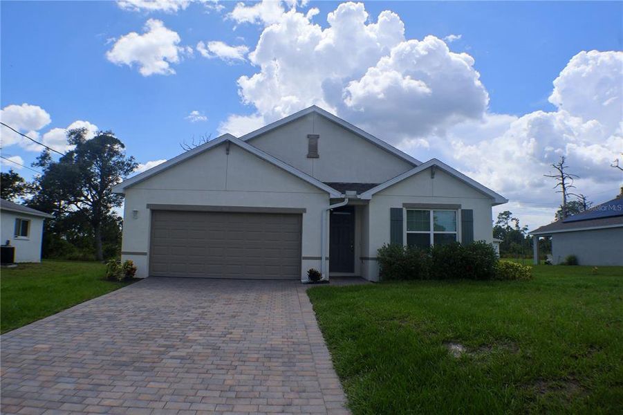 Front exterior of a new home in Gulf Cove, Port Charlotte, FL, highlighting curb appeal (Image 20). Front exterior of a new home in Gulf Cove, Port Charlotte, FL, highlighting curb appeal (Image 20).