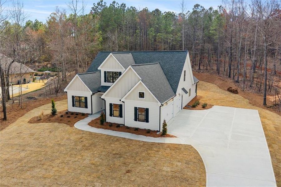 Front exterior of a new home in , Carrollton, GA, highlighting curb appeal (Image 21).