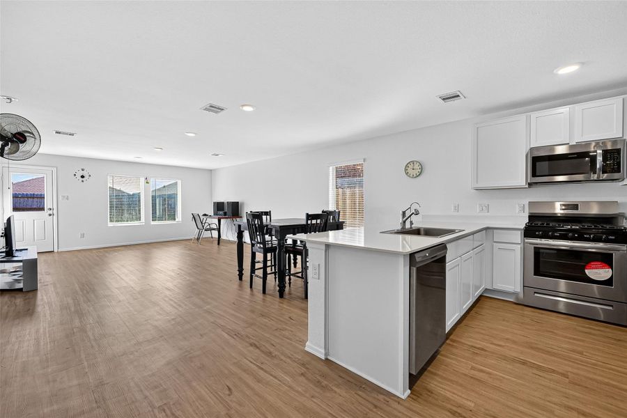Furnished interior view inside a new home in Sunterra: Watermill Collection, Katy (Image 4).