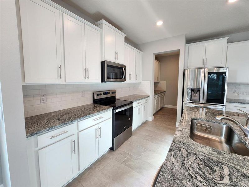 Furnished interior view inside a new home in Woodcreek, Wesley Chapel (Image 3).
