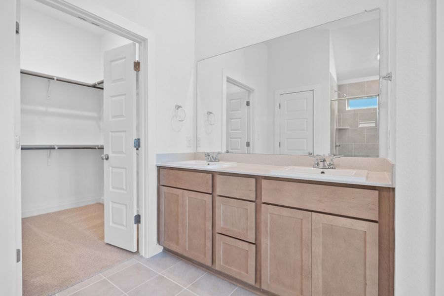 Primary Bath in the Quartz home plan by Trophy Signature Homes – REPRESENTATIVE PHOTO