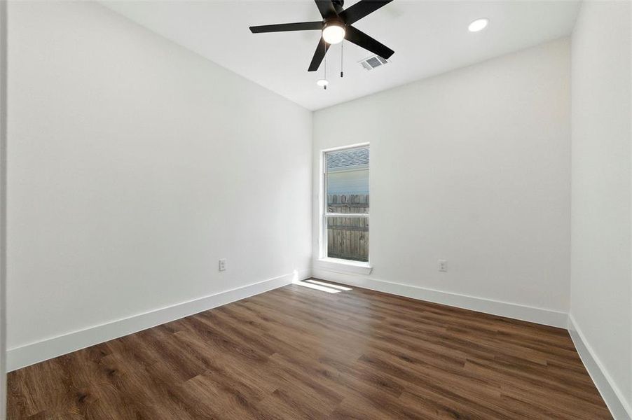 Unfurnished room with ceiling fan, dark wood-style flooring, and recessed lighting