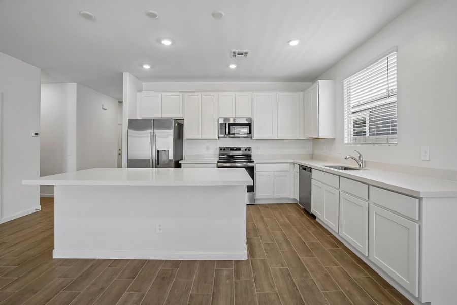 Kitchen featuring the Essentials finishes. Representative images and renderings are for illustrative purposes. Actual structural options and design finishes of home may vary. Kitchen featuring the Essentials finishes. Representative images and renderings are for illustrative purposes. Actual structural options and design finishes of home may vary.
