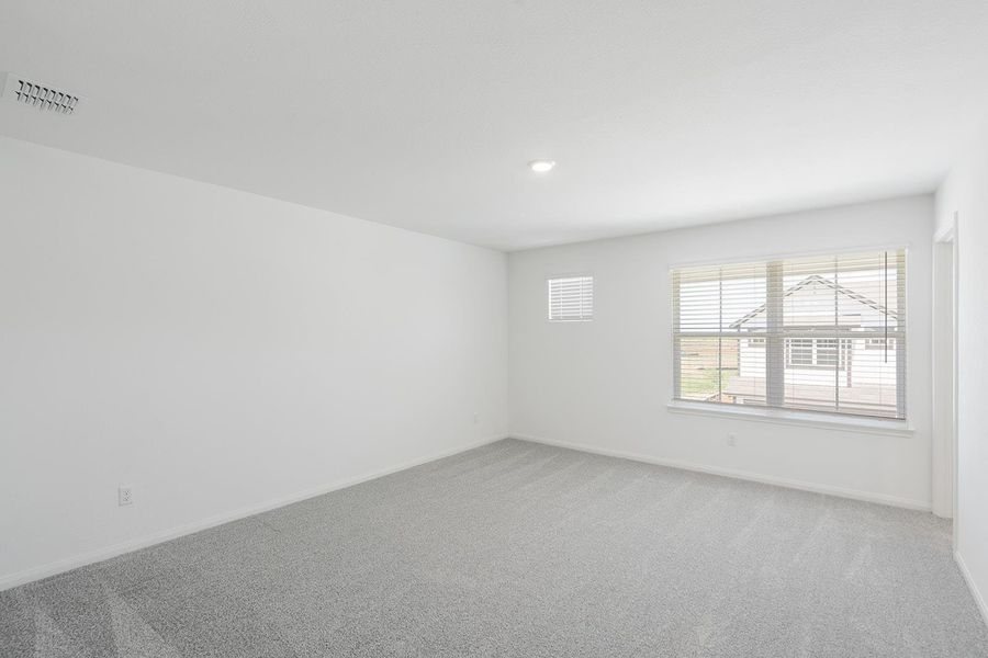 Unfurnished room featuring carpet flooring and baseboards Unfurnished room featuring carpet flooring and baseboards