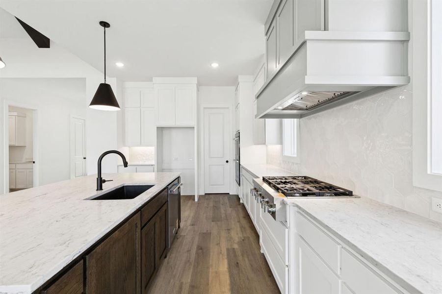 Beautiful cabinetry, gorgeous counter tops and striking accents effortlessly blend with contemporary stainless steel to create the kitchen of your dreams!