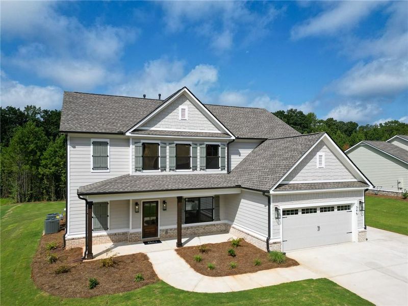 Front exterior of a new home in Weslyn Park, Social Circle, GA, highlighting curb appeal (Image 18). Front exterior of a new home in Weslyn Park, Social Circle, GA, highlighting curb appeal (Image 18).
