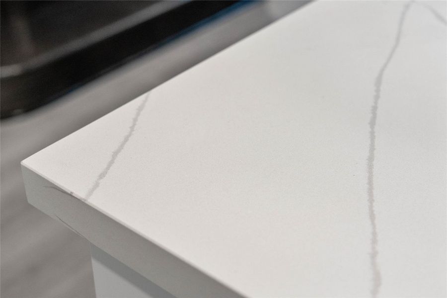This striking quartz countertop combines the elegant, deep-veined look of natural stone with a highly durable, non-porous surface that is exceptionally resistant to scratches, stains, and daily wear.