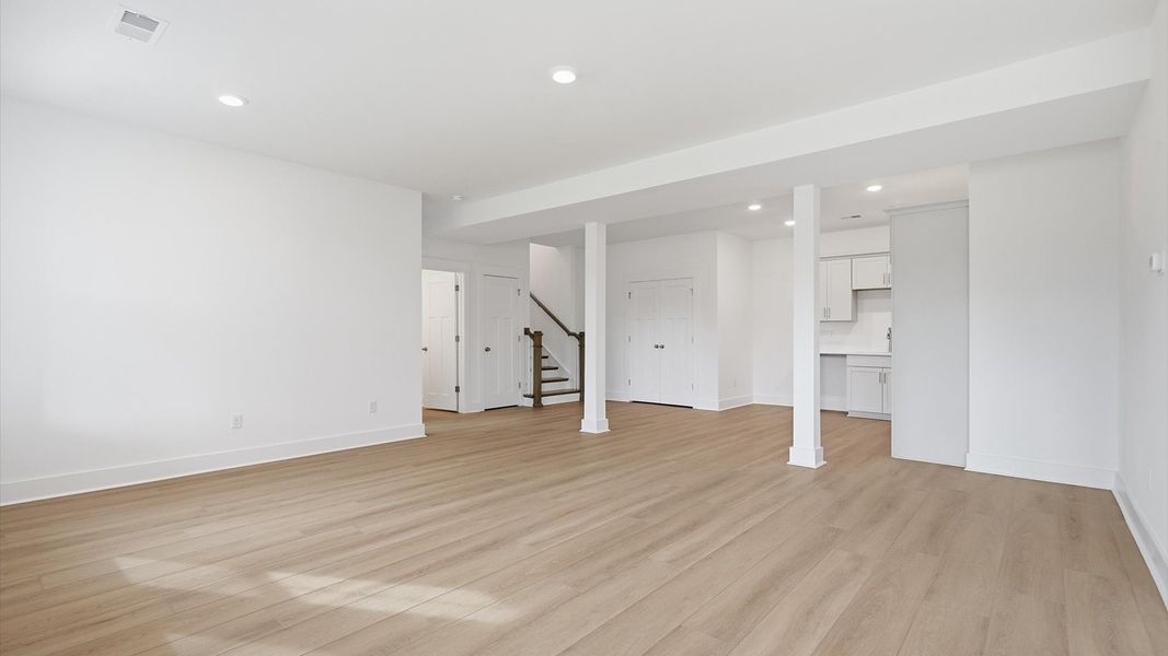 Versatile basement living room ideal for entertaining, recreation, or quiet relaxation at the Pinebrook community