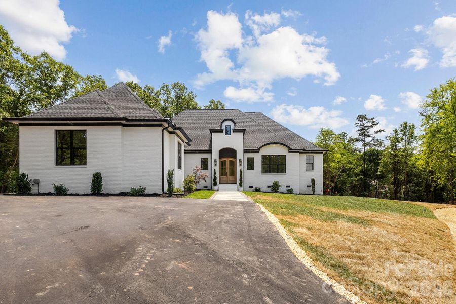 Front exterior of a new home in , Clover, SC, highlighting curb appeal (Image 24).