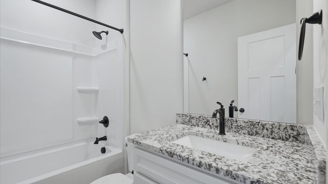 Top-notch bathroom with current fixtures, tasteful materials, and elevated charm at Fox Hollow