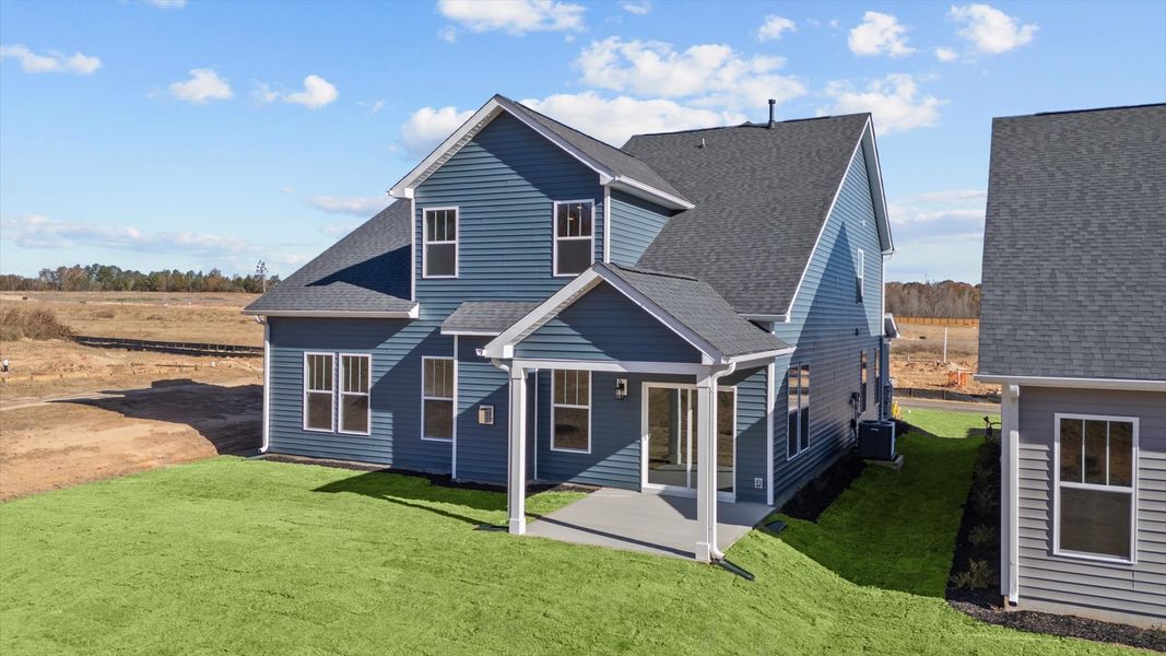 Superior curb appeal continues to the back with a refined, covered outdoor living space