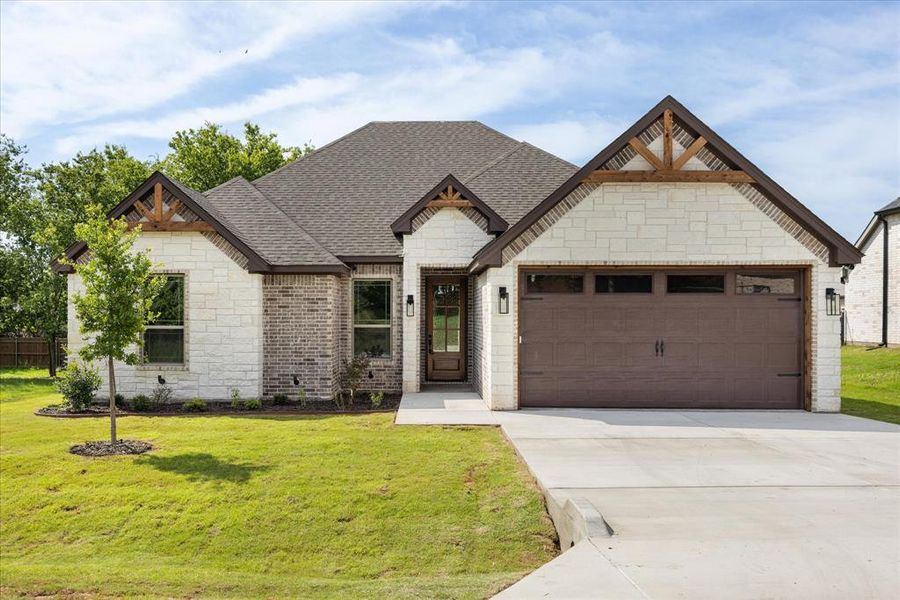 Front exterior of a new home in , Granbury, TX, highlighting curb appeal (Image 2). Front exterior of a new home in , Granbury, TX, highlighting curb appeal (Image 2).