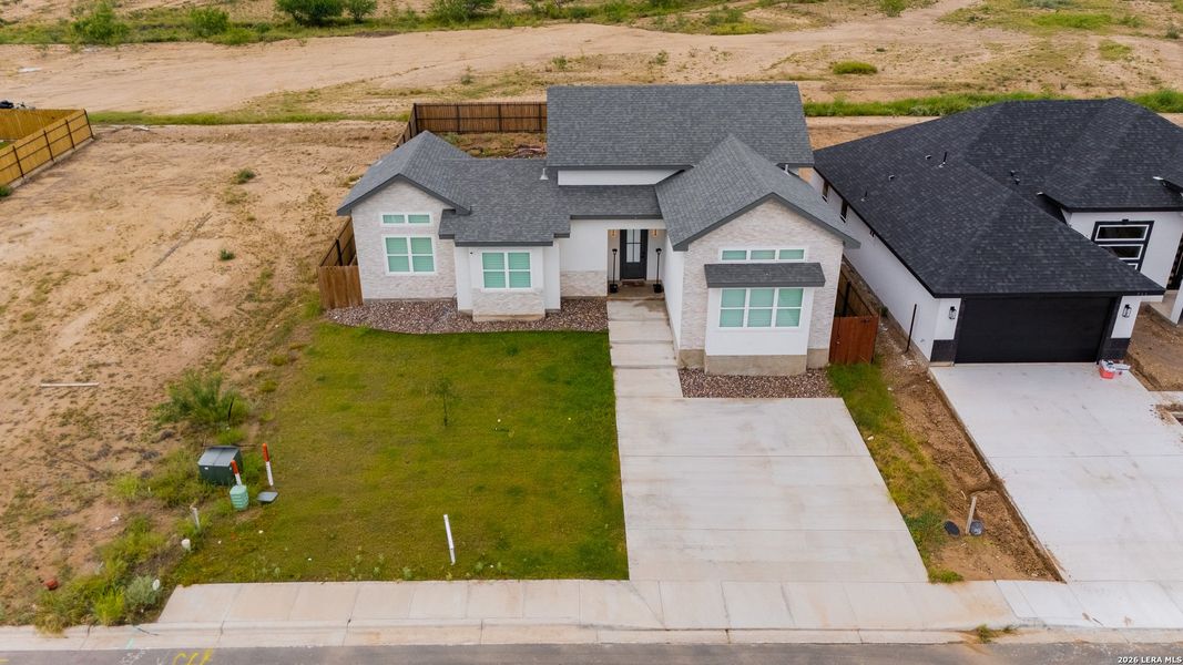 Front exterior of a new home in , Eagle Pass, TX, highlighting curb appeal (Image 2). Front exterior of a new home in , Eagle Pass, TX, highlighting curb appeal (Image 2).