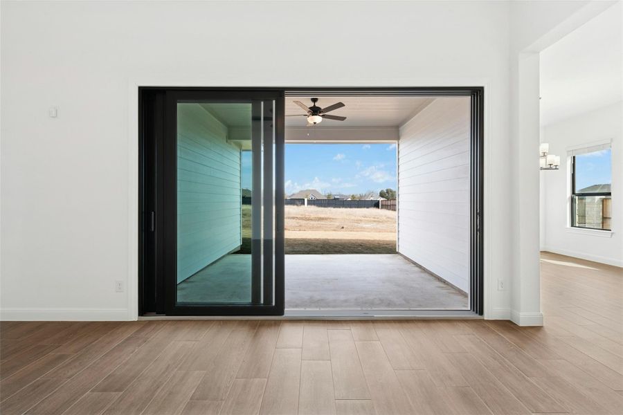 Entryway with wood finished floors and ceiling fan