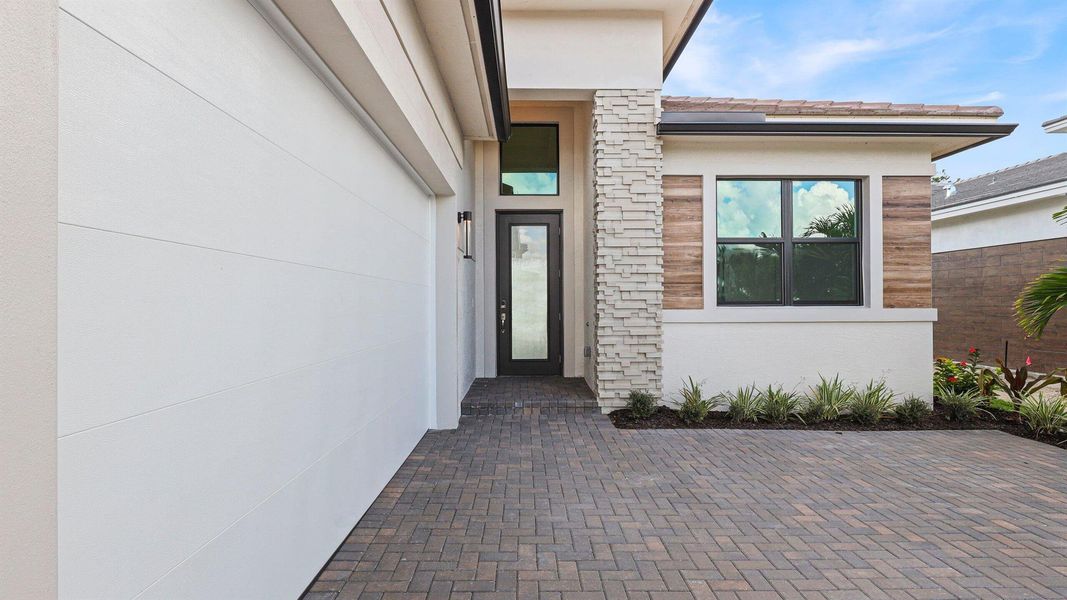 Exterior details and patio area of a home in L'Ambiance at Avenir, Palm Beach Gardens (Image 4). Exterior details and patio area of a home in L'Ambiance at Avenir, Palm Beach Gardens (Image 4).