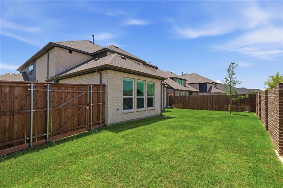 Exterior details and patio area of a home in Valencia on The Lake, Little Elm (Image 3).