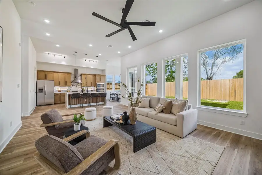 Open floor plan, flooded with upgraded finishes, large windows that lookout into a nice yard with a covered patio. Perfect for entertaining
