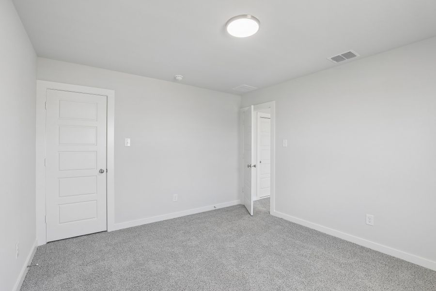 Bedroom in the Holden home plan by Trophy Signature Homes