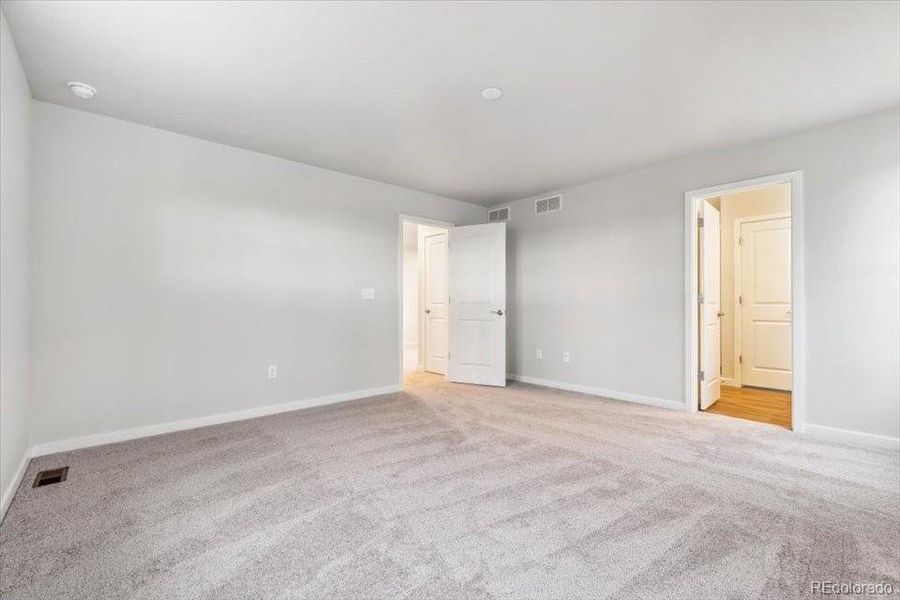 Spacious, unfurnished interior of a new home in The Haven II Collection  at Painted Prairie, Aurora (Image 15).