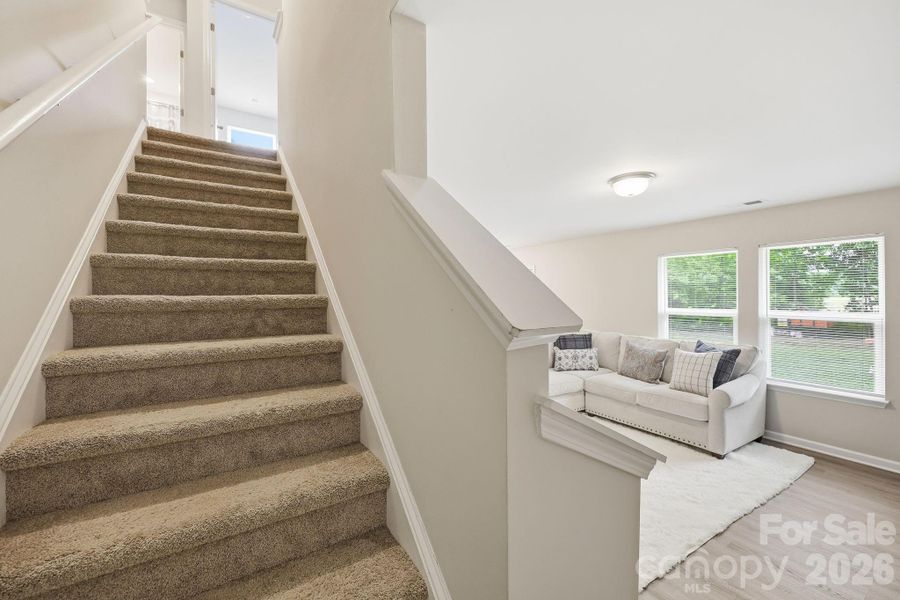 Tucked away stairs off of the Living Room