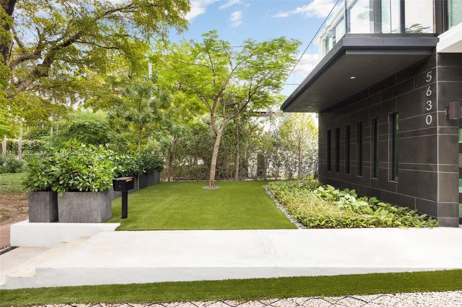 Front exterior of a new home in , Miami Beach, FL, highlighting curb appeal (Image 25). Front exterior of a new home in , Miami Beach, FL, highlighting curb appeal (Image 25).