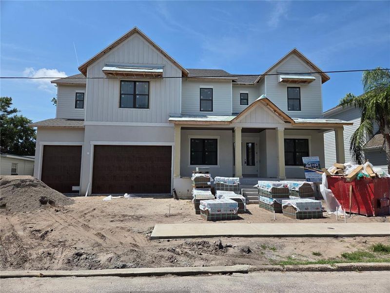 Front exterior of a new home in , Tampa, FL, highlighting curb appeal (Image 1).