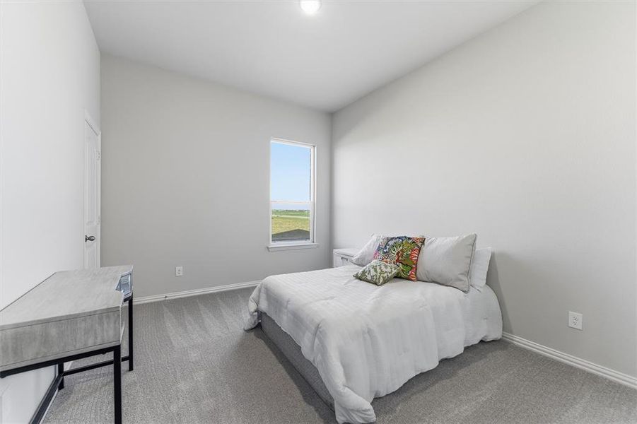 Bedroom featuring carpet floors