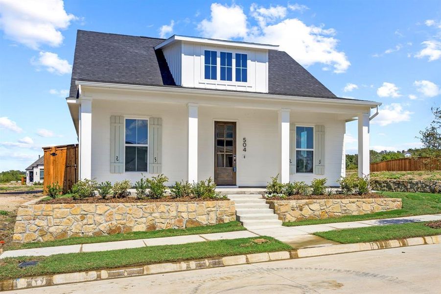 Front exterior of a new home in The Heights at Uptown Celina, Celina, TX, highlighting curb appeal (Image 2).