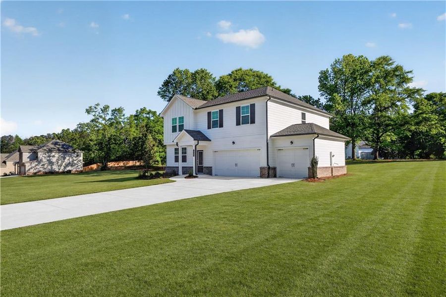 Front exterior of a new home in Shadow Creek, Jackson, GA, highlighting curb appeal (Image 2).